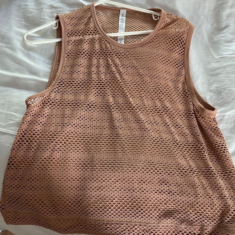 Lululemon perforated tank. Size 10. Light pink/ peach/ beige color. Great cond.